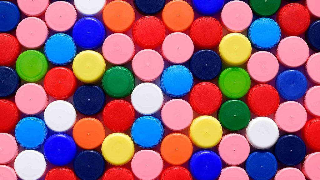 A colorful array of plastic caps illustrates a new era that began in the 1940s.